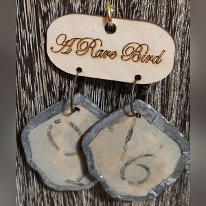 A rare bird tag earrings